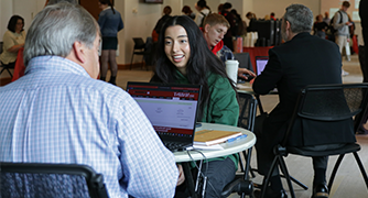 image of student talking with a professor